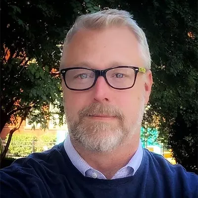 Informal headshot of Ryan Corrigan, Executive Director